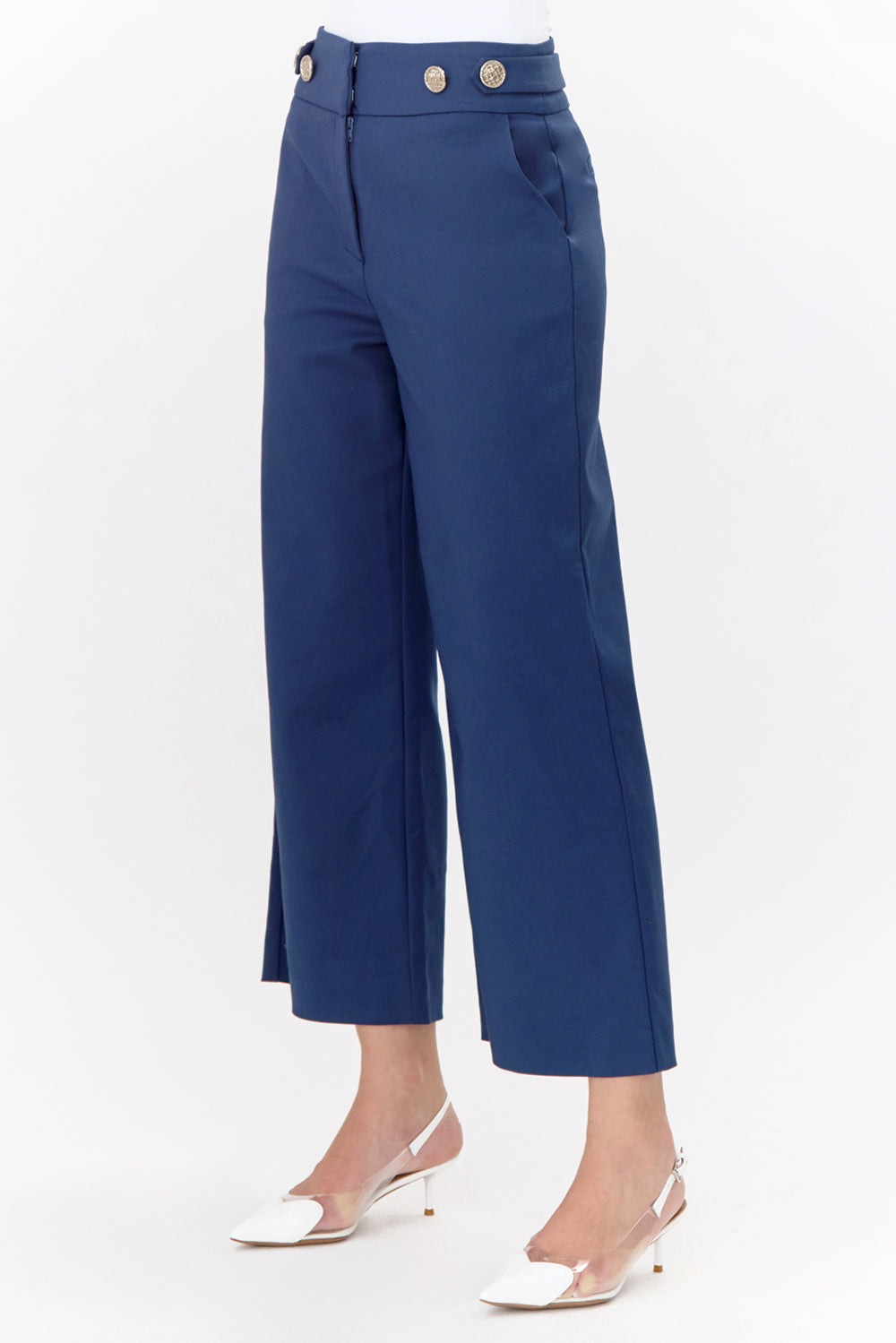 Side view of wide-leg, navy trousers with gold buttons.